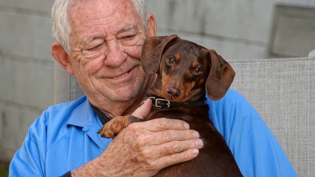 Elderly gentleman with Dachshund